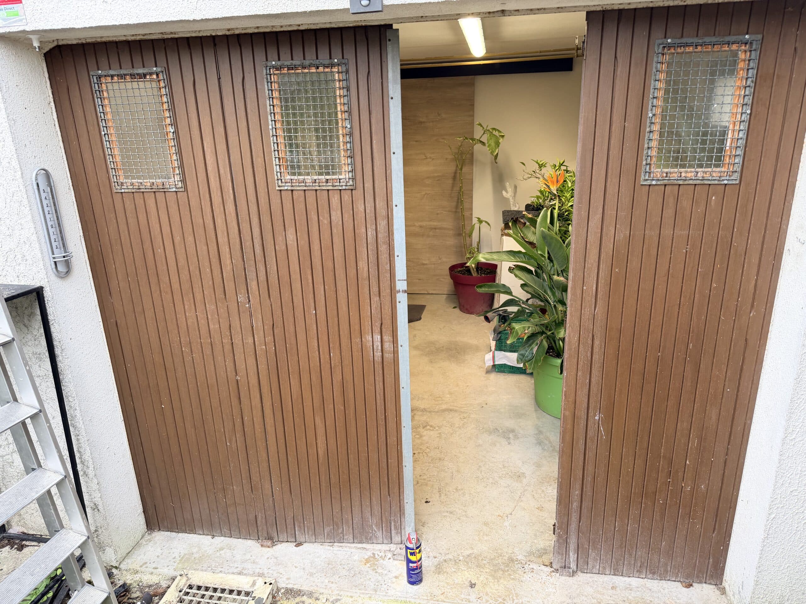 Porte de garage en baie vitrée avant